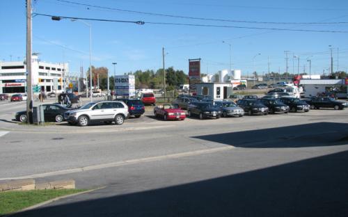 One of the final photos taken of the Hammond Street lot sometime in 2006.  A stalwart of the North Bay automotive scene since 1987 had been the “nice cars on the corner of Fisher”. Shortly after the photo was taken, the lot had to be moved down the street on Fisher St. due to the expansion of Burger World. The Parolin lot had always been located beside a burger joint since inception, change was afoot.