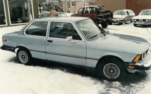 In this album photo we see the Lakeshore lot in winter, being North Bay, a pick up truck with snow machine in the back for added traction is not out of place. The upper left of the photo reveals the “showroom” housing a 1969 Lotus Europa S2. A white 1973 BMW “E3” Bavaria sedan graces this humble Lakeshore lot with its inherent beauty in the upper right.